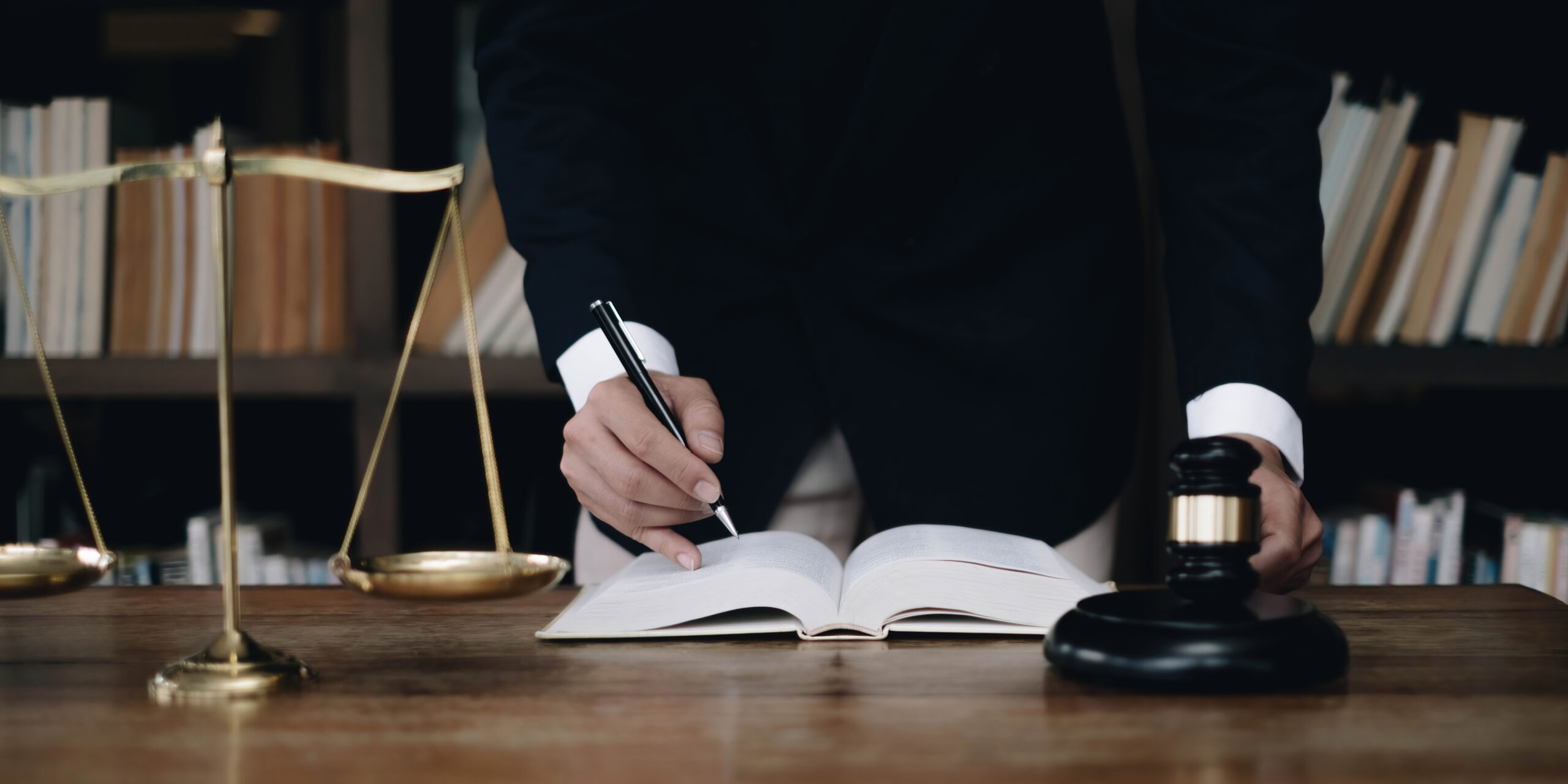 justice and law concept.Male judge in a courtroom on wooden tabl